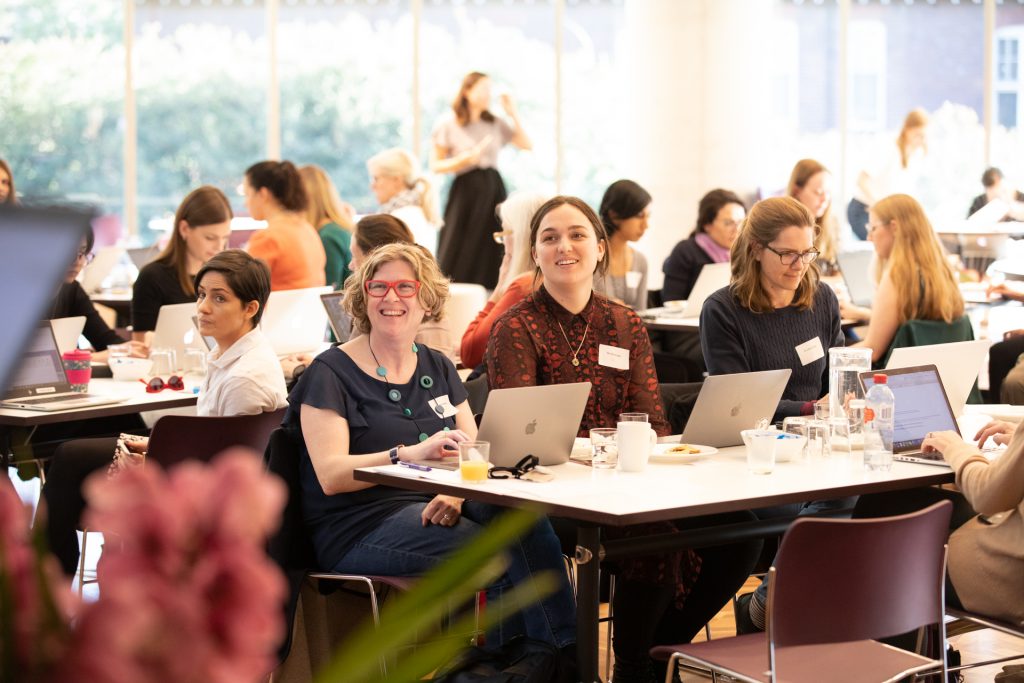 Photo of participants in front of their laptops at previous edit-a-thon